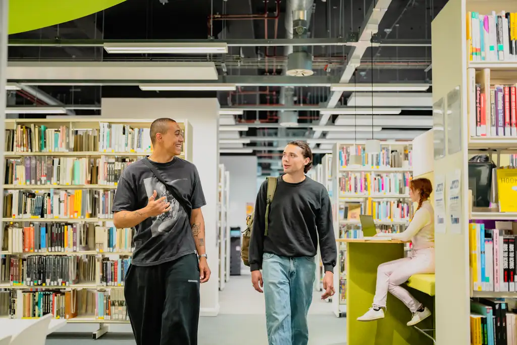 Two students in a University library