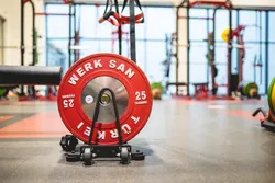 The Strength and Conditioning Centre with a red and black weight on the floor.
