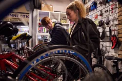 Two students look at the different bicycles on sale at a shop in Pontypridd Market.