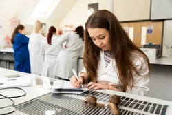 international wildlife biology student zoe in a lab completing analysis of a land snail