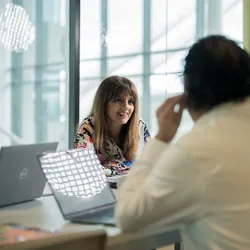 Man talking to woman