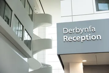 Reception signage at Cardiff Campus.