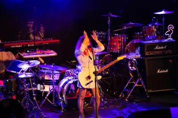 A music student performing at Immersed