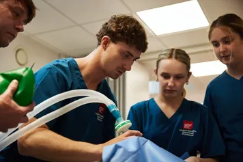 Operating Department Practice students with ventilator.