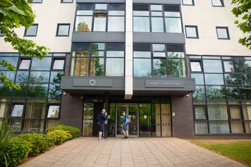 Outdoor view of the building entrance to the Newport Student Village,