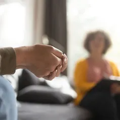 Hands of a patient during appointment with therapist.