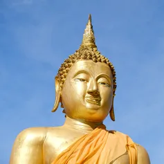 A buddha against blue sky
