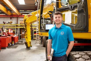 Network75 student Rhys Howells standing in a warehouse