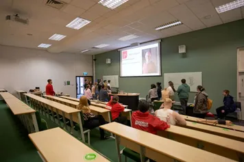 Pupils at a Schools and Colleges event sitting in a lecture hall listening to lecture presentation