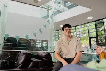 student sat on campus in treforest
