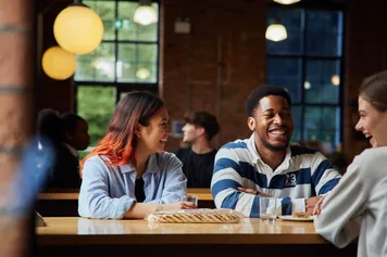 A group of students sat in Crawshays laughing