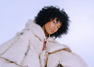 A model posing in a puffer coat designed by a student.