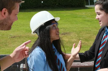 Student wearing a hard hat