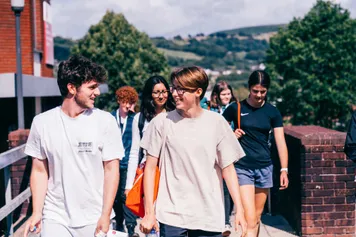 Students smiling at Treforest campus USW Summer School