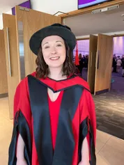 chelsea courts, USW alumni, smiling to camera at graduation