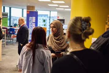 Professionals networking at the Engagement Hub in Newport