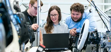 Engineers working on computer