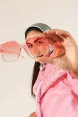 Fashion student photography - student posing with sunglasses and pink jacket