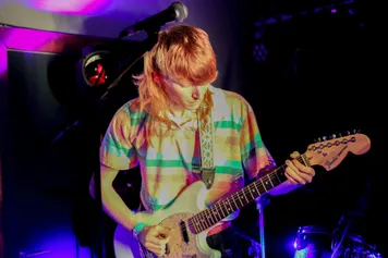 music student playing a guitar