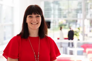 A close-up of researcher Helen Jones smiling at the camera