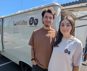 Business graduate Alicia Smith (right) with her partner Mathew Hunt in front of their coffee van
