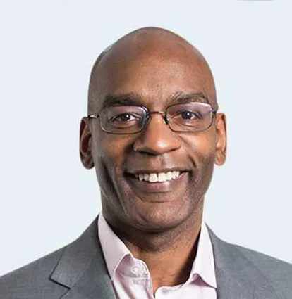 Profile of alumni Nigel Walker smiling to camera