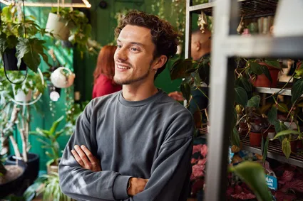 A student smiling while shopping in Cardiff.
