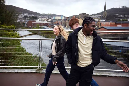 Students in pontypridd crossing a bridge