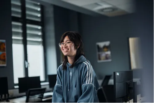 Sam Kwan smiling off camera