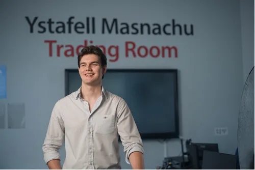 Accounting student Tom smiling for a portrait shot