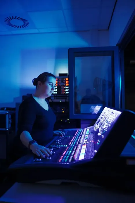 Student, Hannah, using a computer with blue lighting