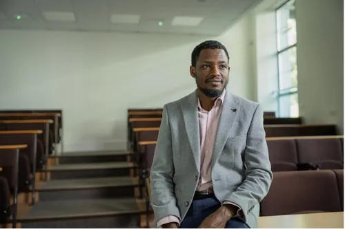 Law student Abdu smiles for a profile shot