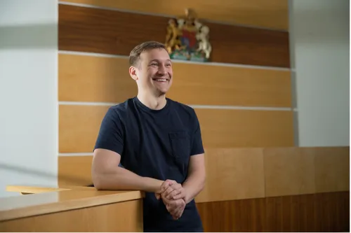Law student Matthew smiles for a profile shot