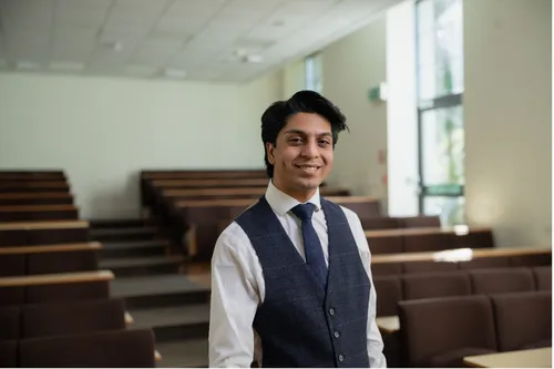 Law student Sahil smiles for a profile shot.
