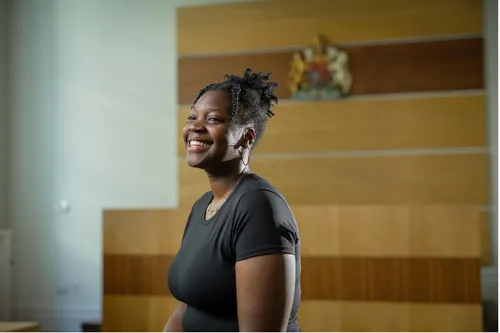 Law student Zoe smiles for a profile shot.