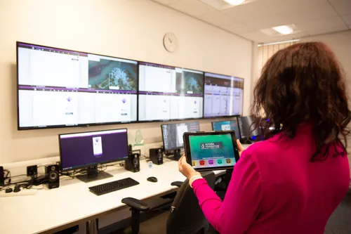 person holding ipad in front of hydra simulation centre