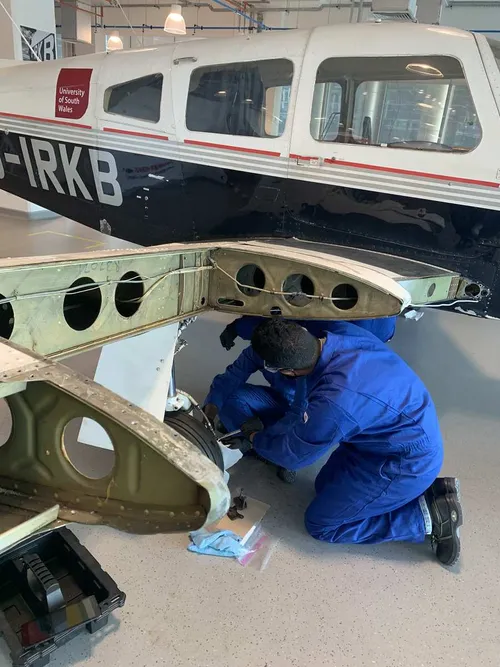Rishika fixing part of a plane in the Aerospace Centre on Treforest campus