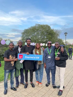 A group of students smiling at the camera during International Welcome Programme