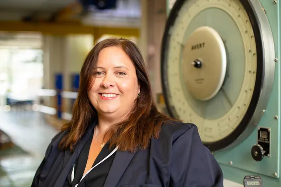 Civil engineering academic Joanna Thomas smiles at the camera from an engineering workshop at the Treforest campus
