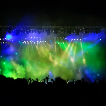 A stage with blue and green lights