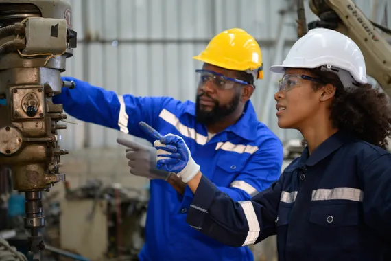 Two engineers consulting and exchanging repair experience with each other