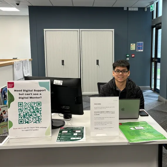 digital mentor sat behind digital mentor desk on Treforest campus