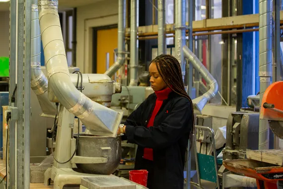 Civil engineering student operating machinery.