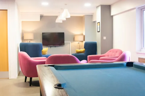 communal space at cardiff accommodation, sofas, television and a pool table