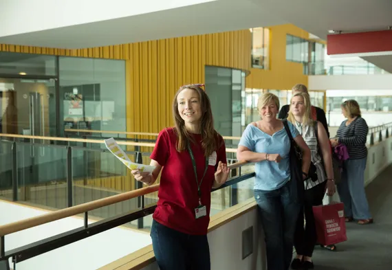 A student ambassador giving a tour of the Treforest campus with a group of open day visitors.