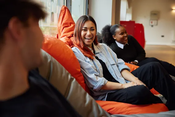 Students sat on beanbags and laughing in the accommodation hub.