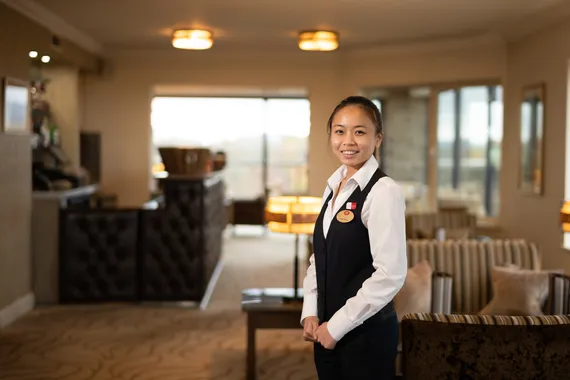 A Hotel and Hospitality Management student in uniform at the Celtic Manor Hotel