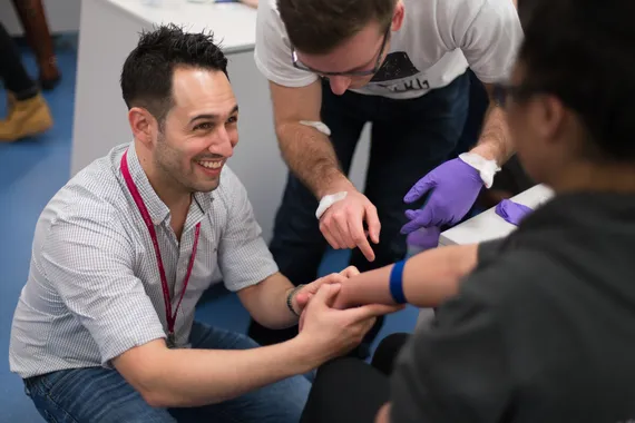 A few students undertaking a practical session in a medical sciences classroom