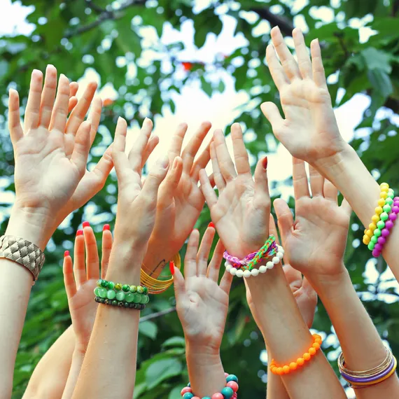 Young girls hands in the air