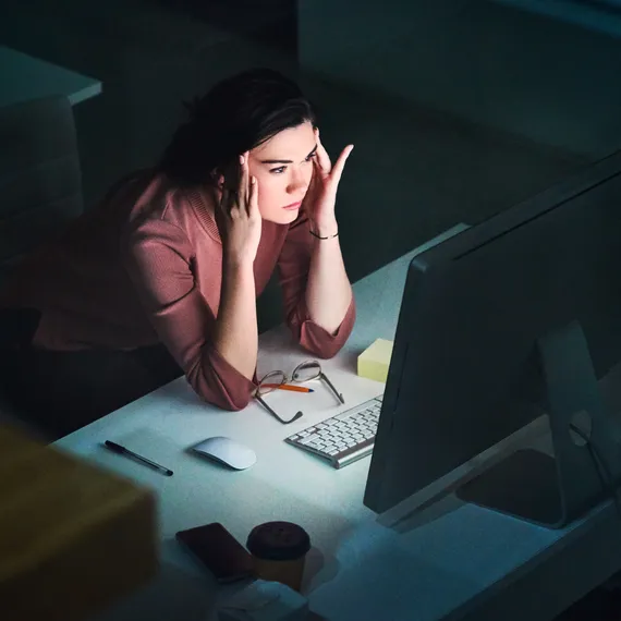 Woman staring at computer